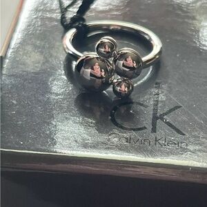 Silver Calvin Klein rotating ring in size 8 comes with box and satin pouch